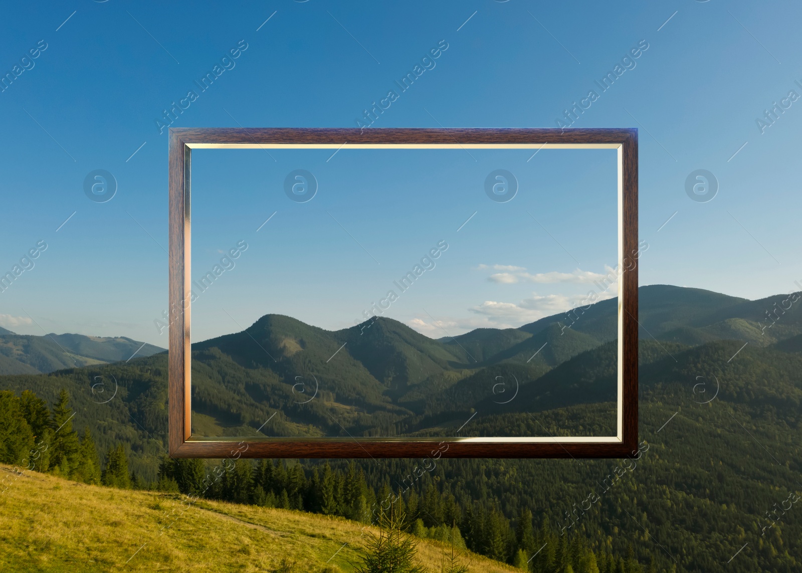 Image of Wooden frame and beautiful mountains under blue sky