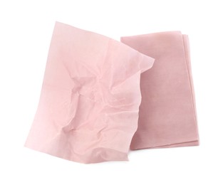 Photo of Pink reusable beeswax food wraps on white background, top view