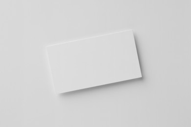 Photo of Blank business card on white background, top view. Mockup for design