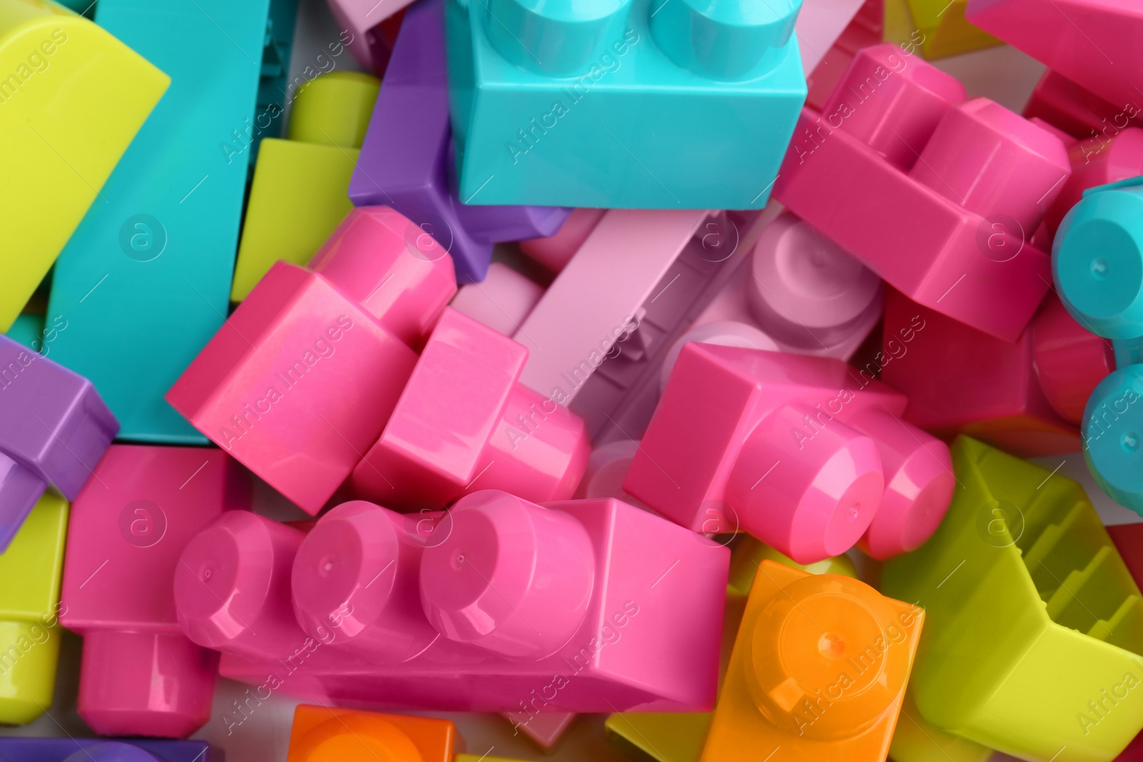 Photo of Colorful blocks as background, closeup. Children's toys