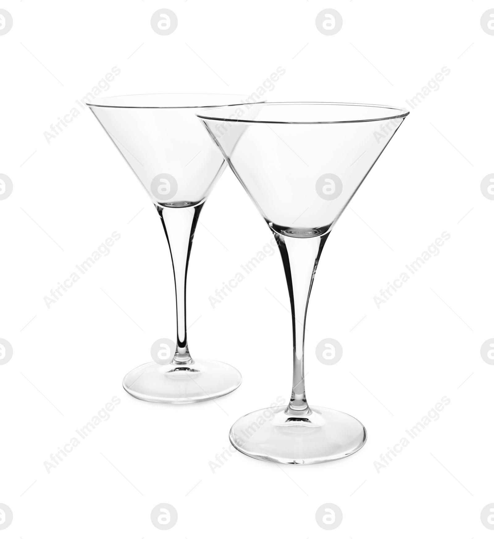 Photo of Elegant clean empty martini glasses isolated on white