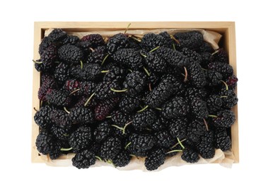 Photo of Ripe black mulberries in wooden box on white background, top view