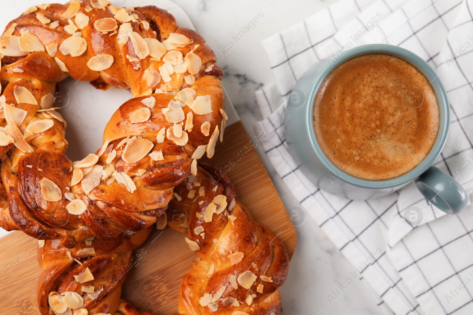 Photo of Delicious pastries and coffee on marble table, flat lay