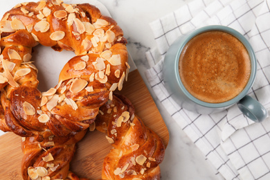 Delicious pastries and coffee on marble table, flat lay