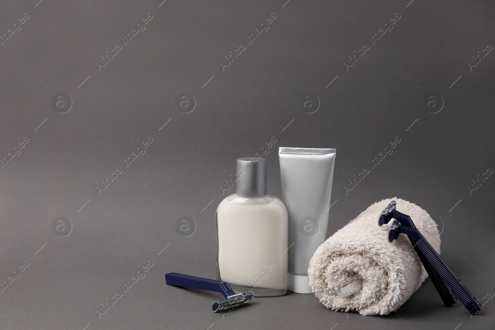 Photo of Different men's shaving accessories on dark grey background. Space for text