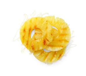 Photo of Tasty grilled pineapple slices isolated on white, top view