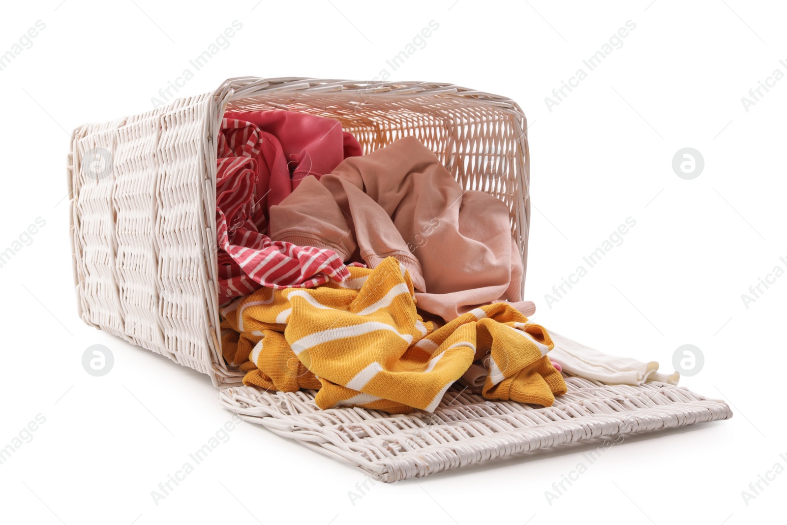 Photo of Overturned laundry basket with dirty clothes isolated on white