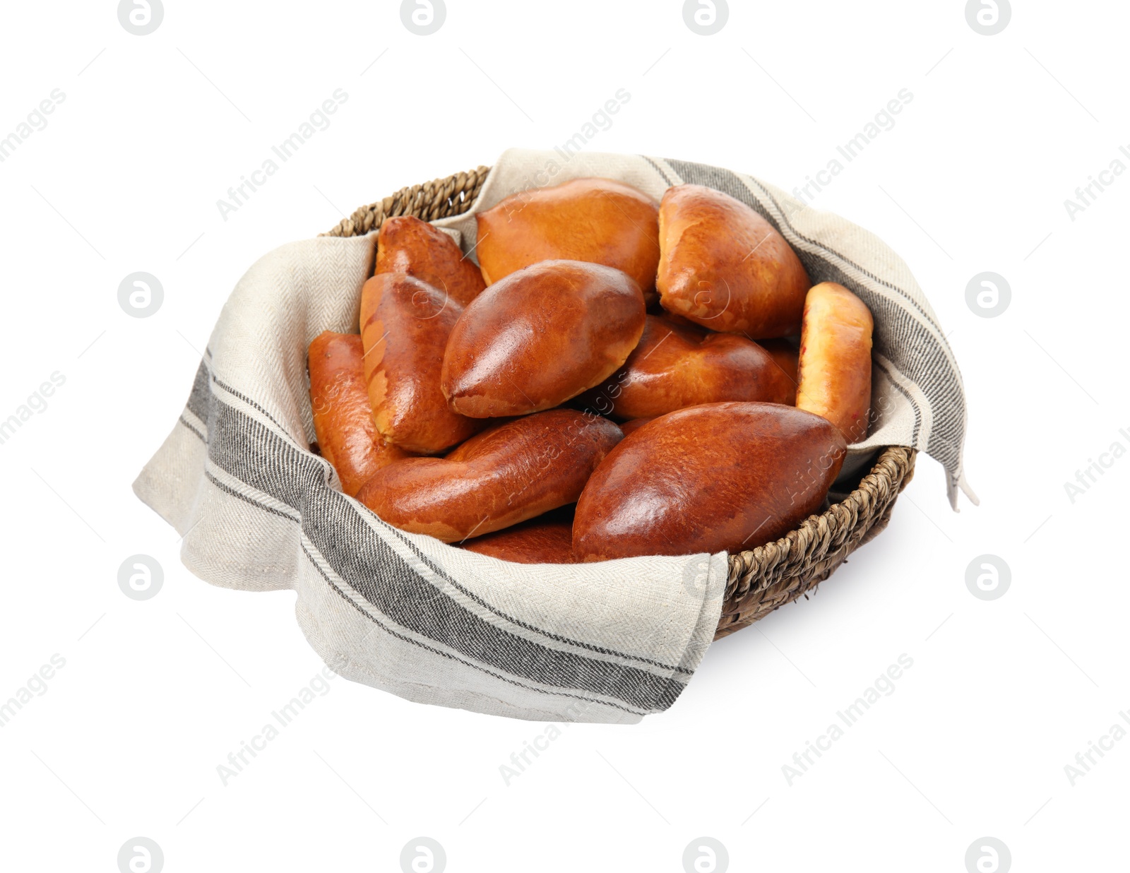 Photo of Wicker basket with delicious baked pirozhki on white background