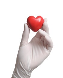 Photo of Doctor in medical glove holding red heart on white background, closeup