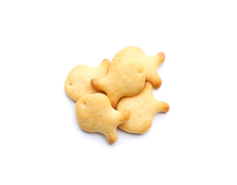 Delicious crispy goldfish crackers on white background, top view