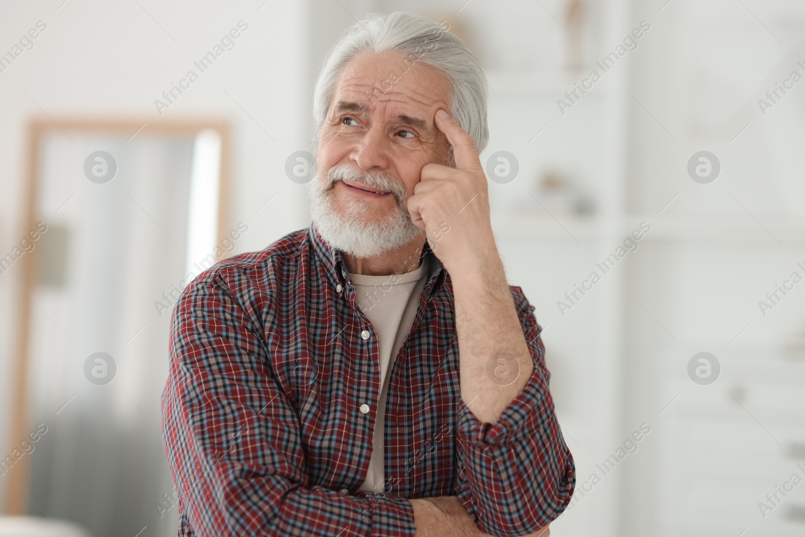 Photo of Portrait of happy grandpa with grey hair indoors