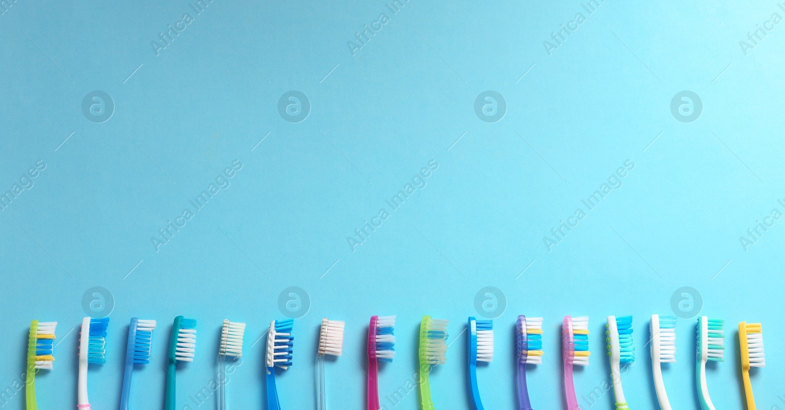 Photo of Flat lay composition with toothbrushes on color background. Space for text