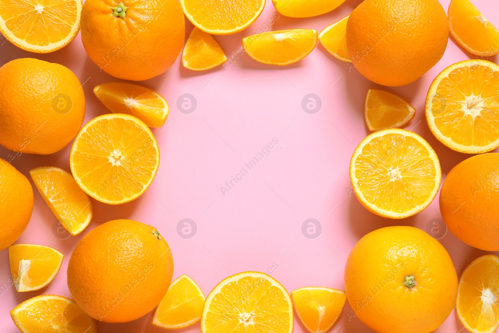 Photo of Flat lay composition with ripe oranges and space for text on color background