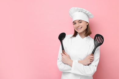 Photo of Professional chef with skimmer and ladle on pink background. Space for text