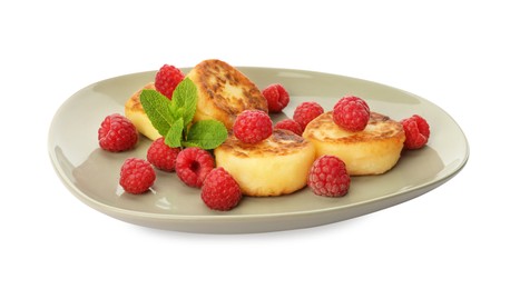 Photo of Plate of delicious cottage cheese pancakes, fresh raspberries and mint on white background