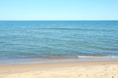 Photo of Beautiful view of sea shore under blue sky on sunny day