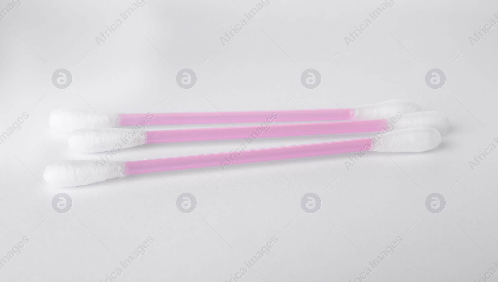 Photo of Clean cotton buds isolated on white. Hygienic product