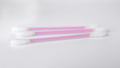 Photo of Clean cotton buds isolated on white. Hygienic product