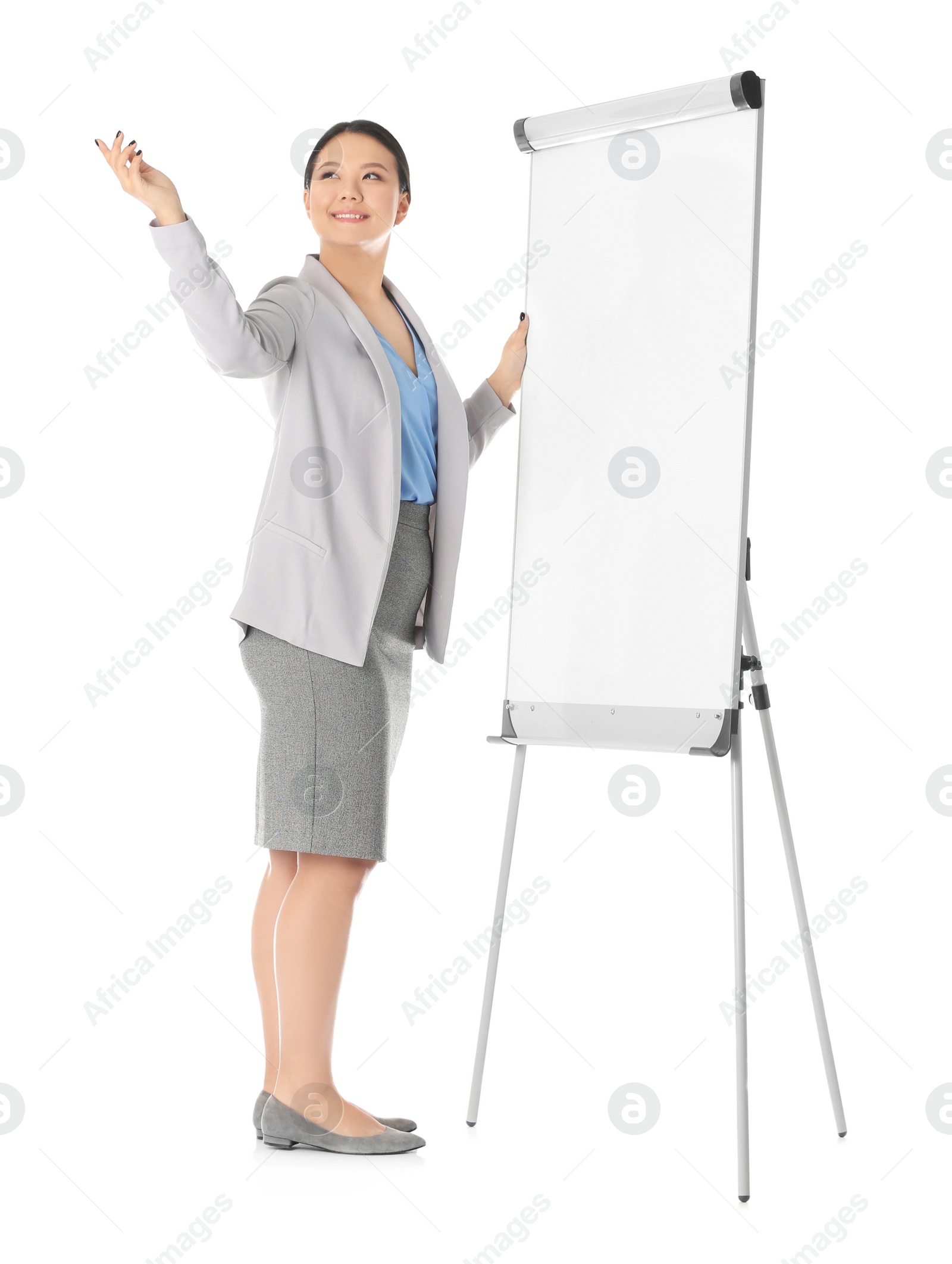 Photo of Business trainer giving presentation on flip chart board against white background