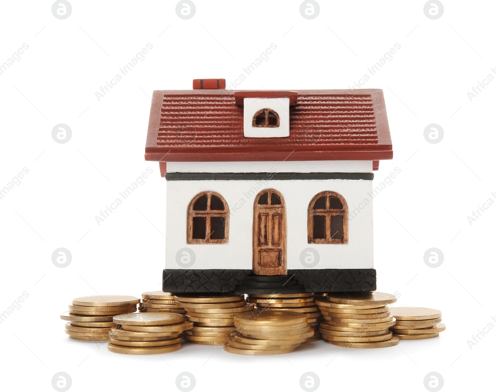 Photo of House model and coins on white background. Heating price concept