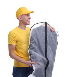 Dry-cleaning delivery. Happy courier holding garment cover with clothes on white background