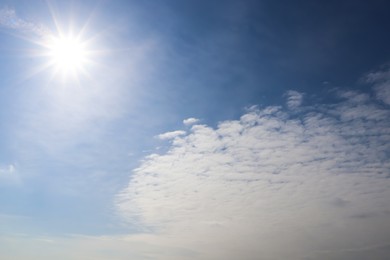 Photo of Sun and white clouds in blue sky outdoors