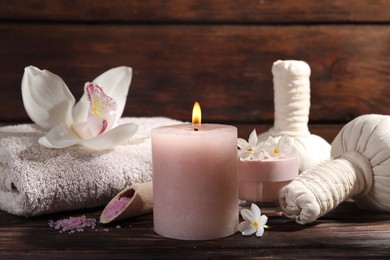 Composition with spa supplies and flowers on wooden table