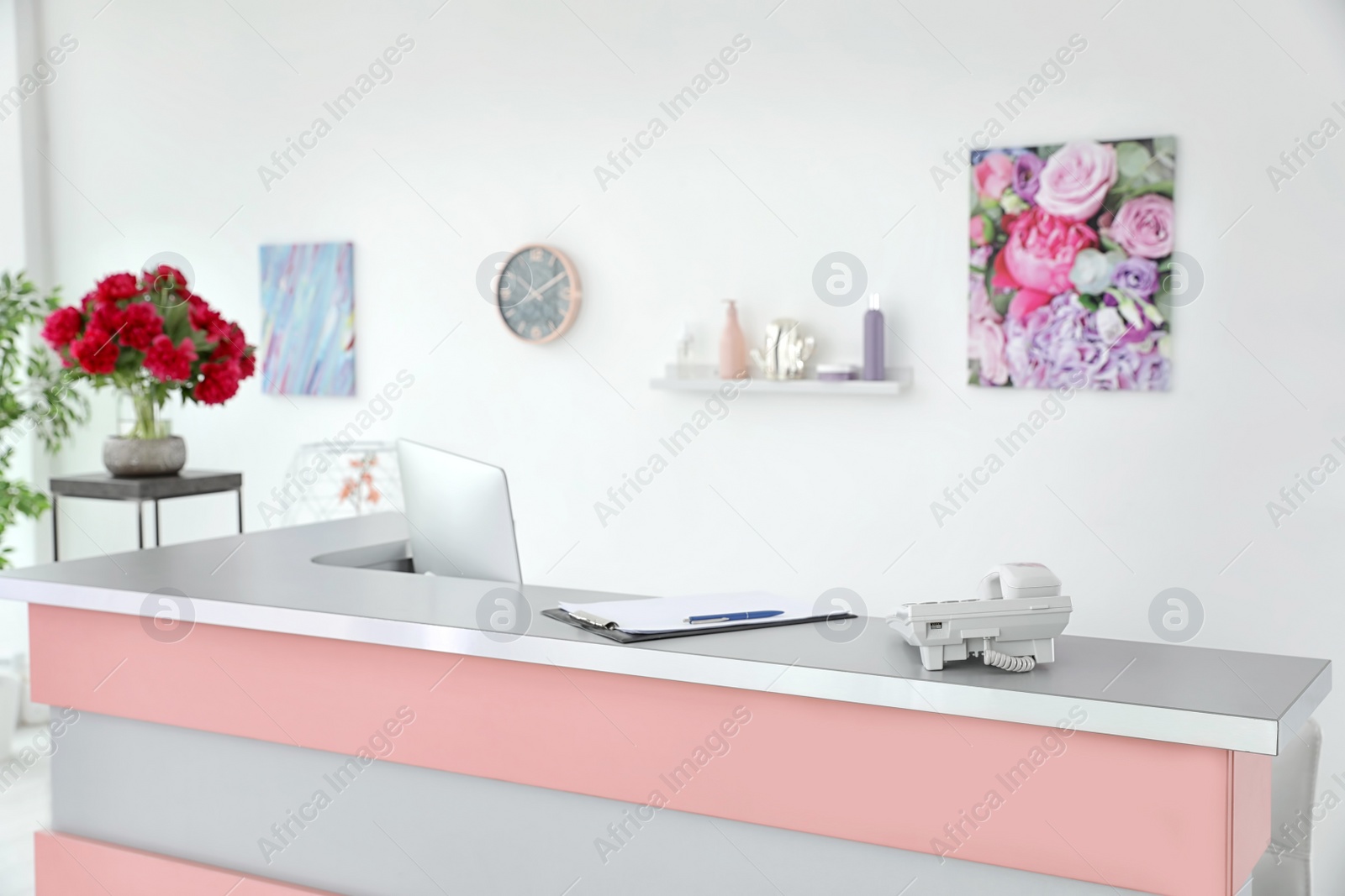 Photo of Beauty salon interior with computer on desk. Receptionist workplace
