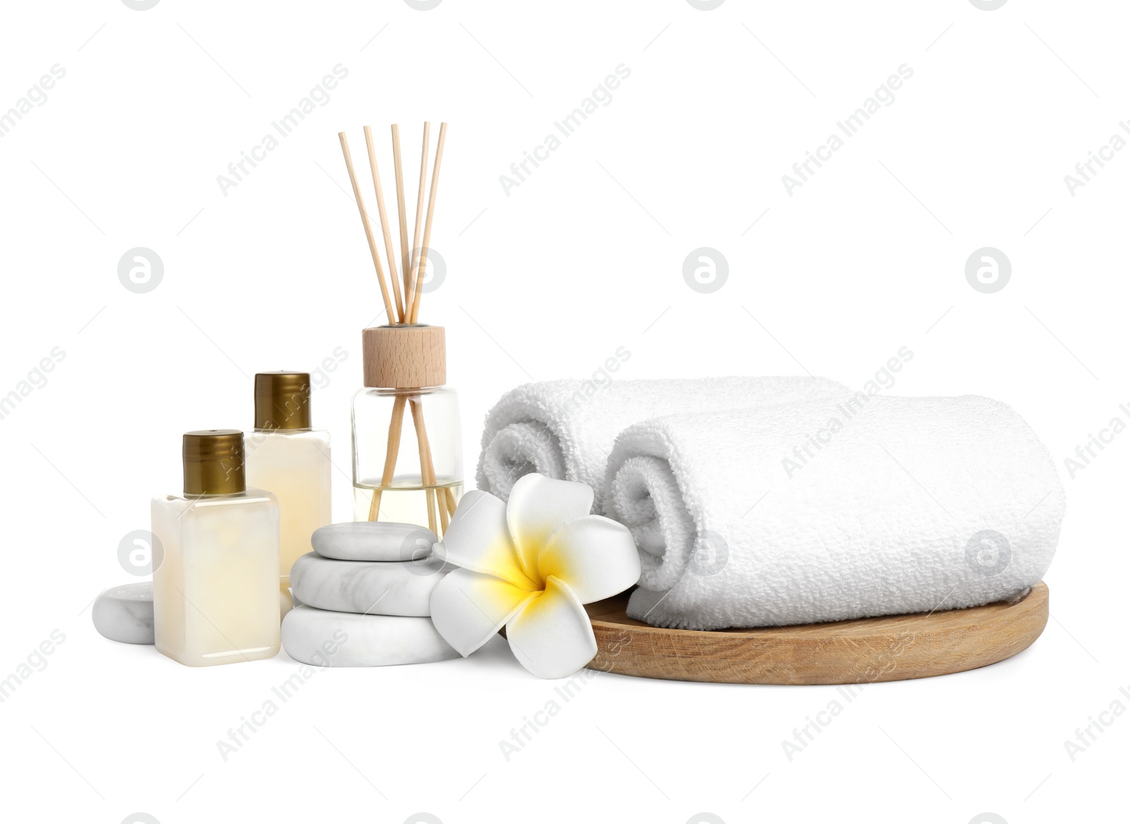 Photo of Beautiful spa composition with reed diffuser on white background