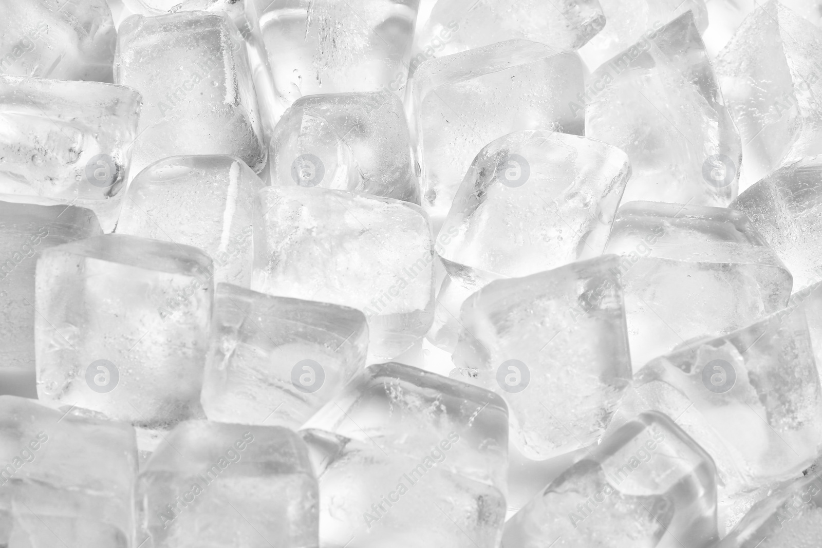 Photo of Pile of ice cubes on white background