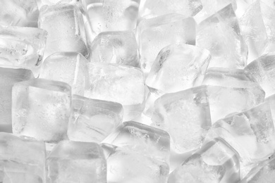 Pile of ice cubes on white background