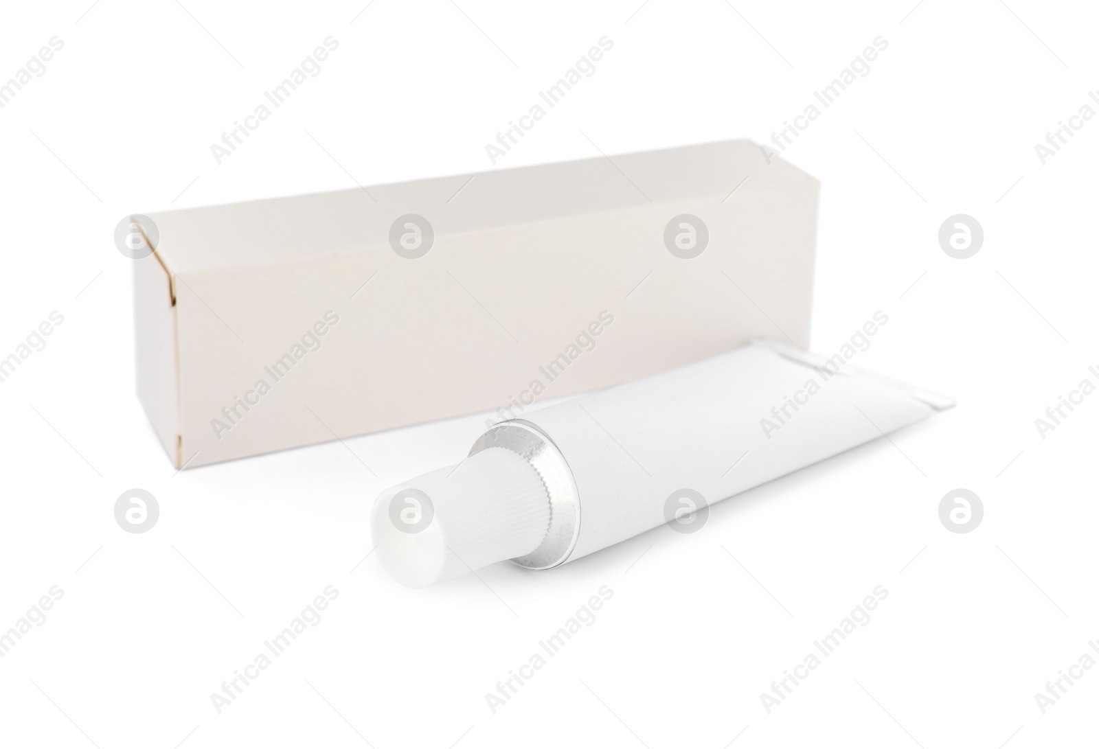 Photo of Blank tube of ointment and package on white background