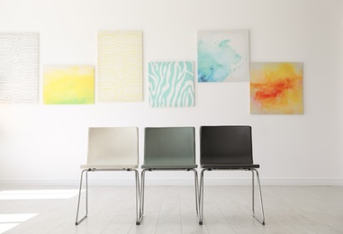 Photo of Chairs at empty exhibition in art gallery