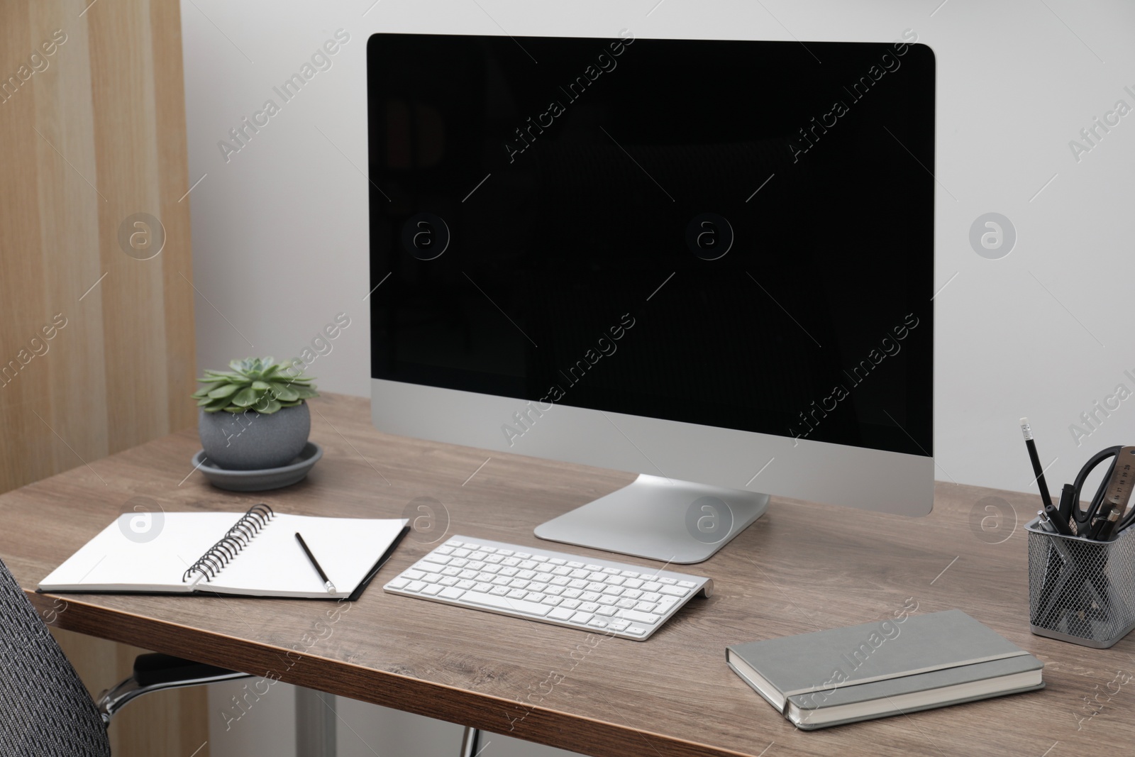 Photo of Workspace with desk and computer at home