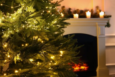 Photo of Beautiful Christmas tree and festive decor in living room, closeup. Space for text