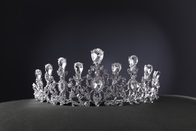 Beautiful silver tiara with diamonds on grey table