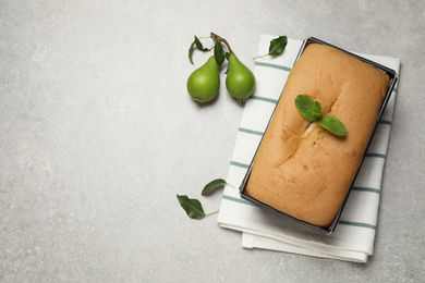 Tasty bread and pears on light grey table, flat lay 
 with space for text. Homemade cake