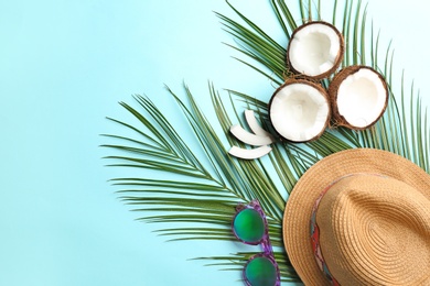 Flat lay composition with coconuts and space for text on color background