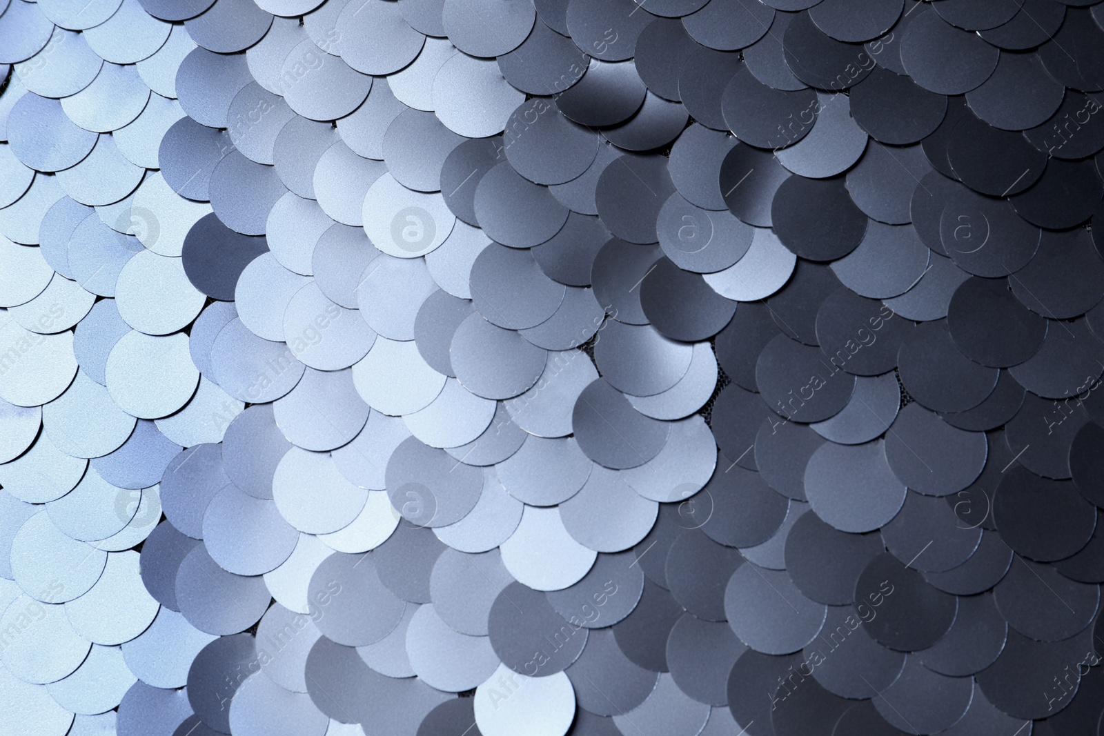 Photo of Texture of beautiful silver sequins as background, closeup