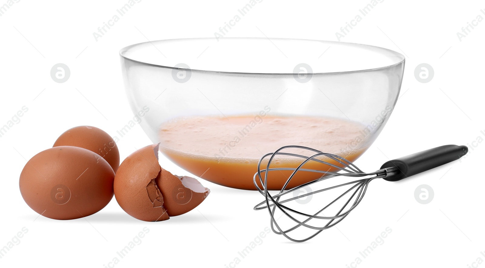 Photo of Metal whisk, beaten eggs in glass bowl and shells isolated on white