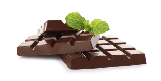 Pieces of chocolate with mint on white background