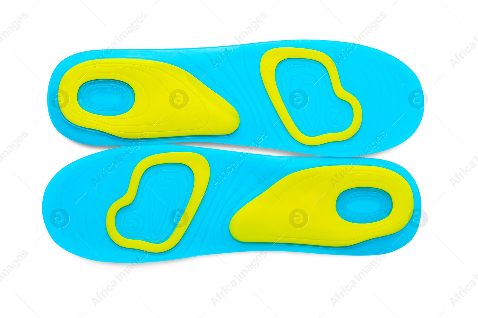 Photo of Light blue orthopedic insoles isolated on white, top view