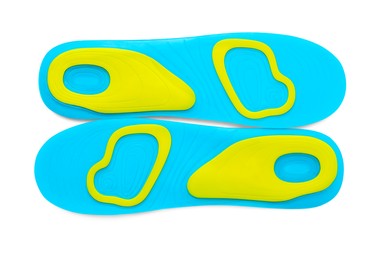 Light blue orthopedic insoles isolated on white, top view