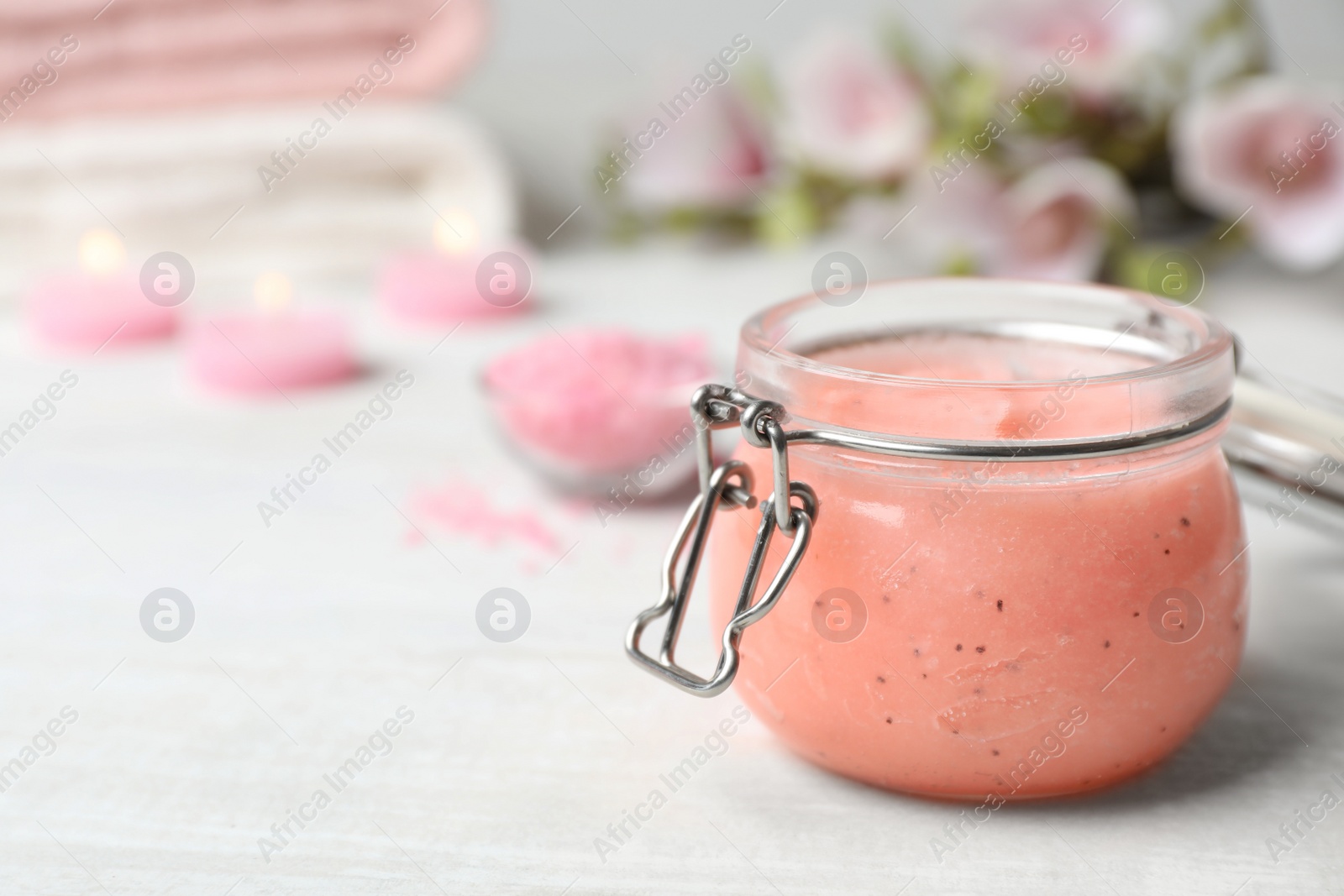 Photo of Jar of organic scrub on table. Space for text