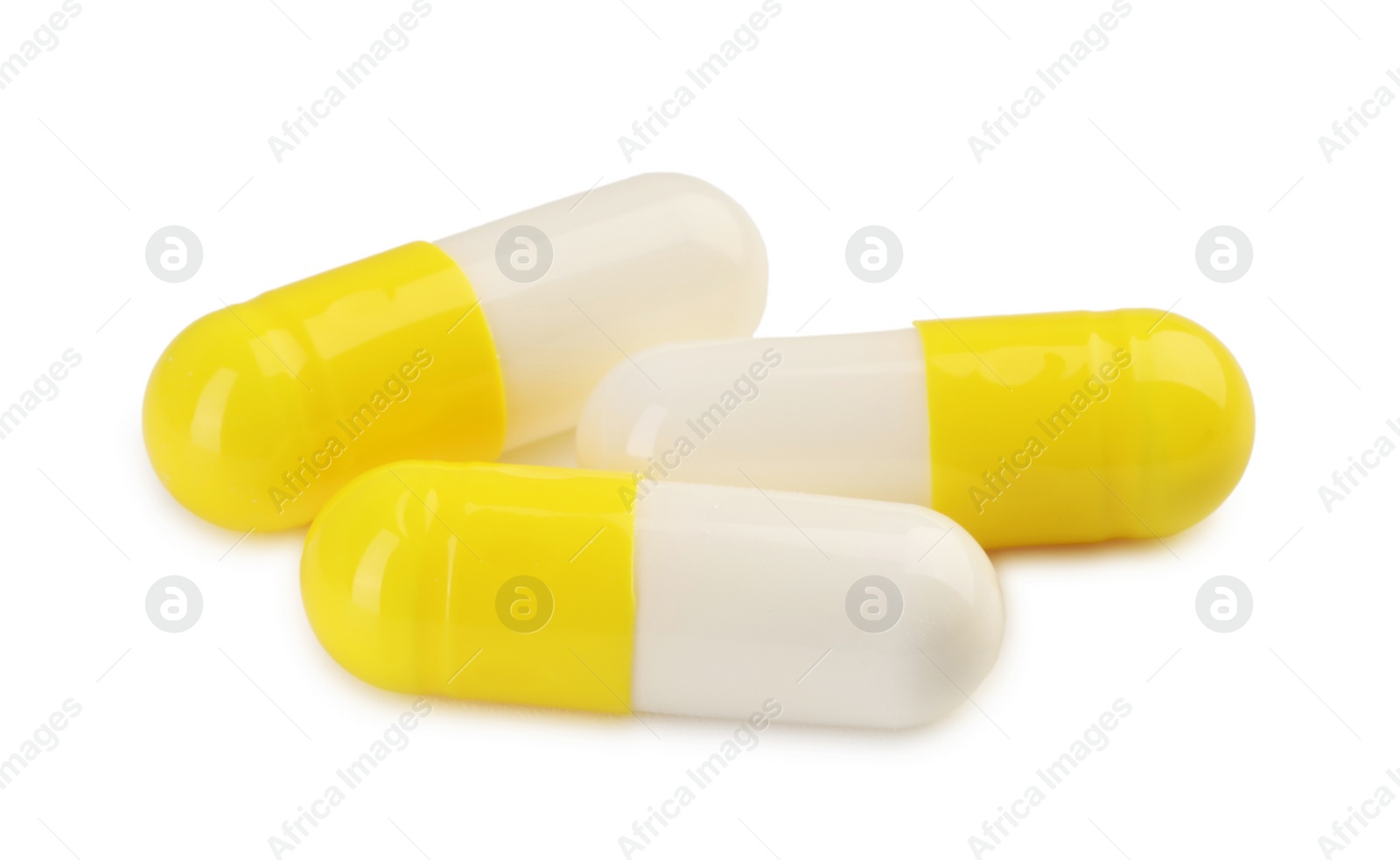 Photo of Three antibiotic pills isolated on white. Medicinal treatment