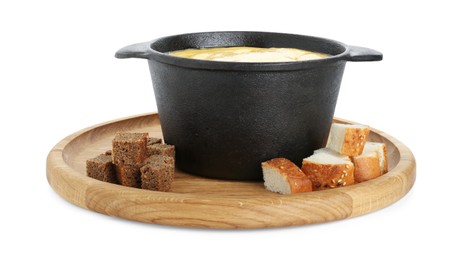Photo of Fondue with tasty melted cheese and pieces of bread isolated on white