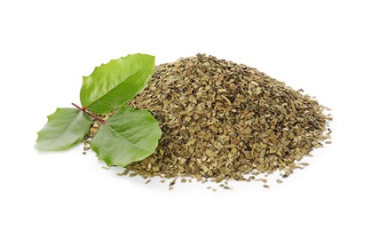 Pile of aromatic mate tea and fresh leaves on white background