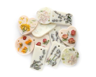Beautiful scented sachets with flowers on white background, top view