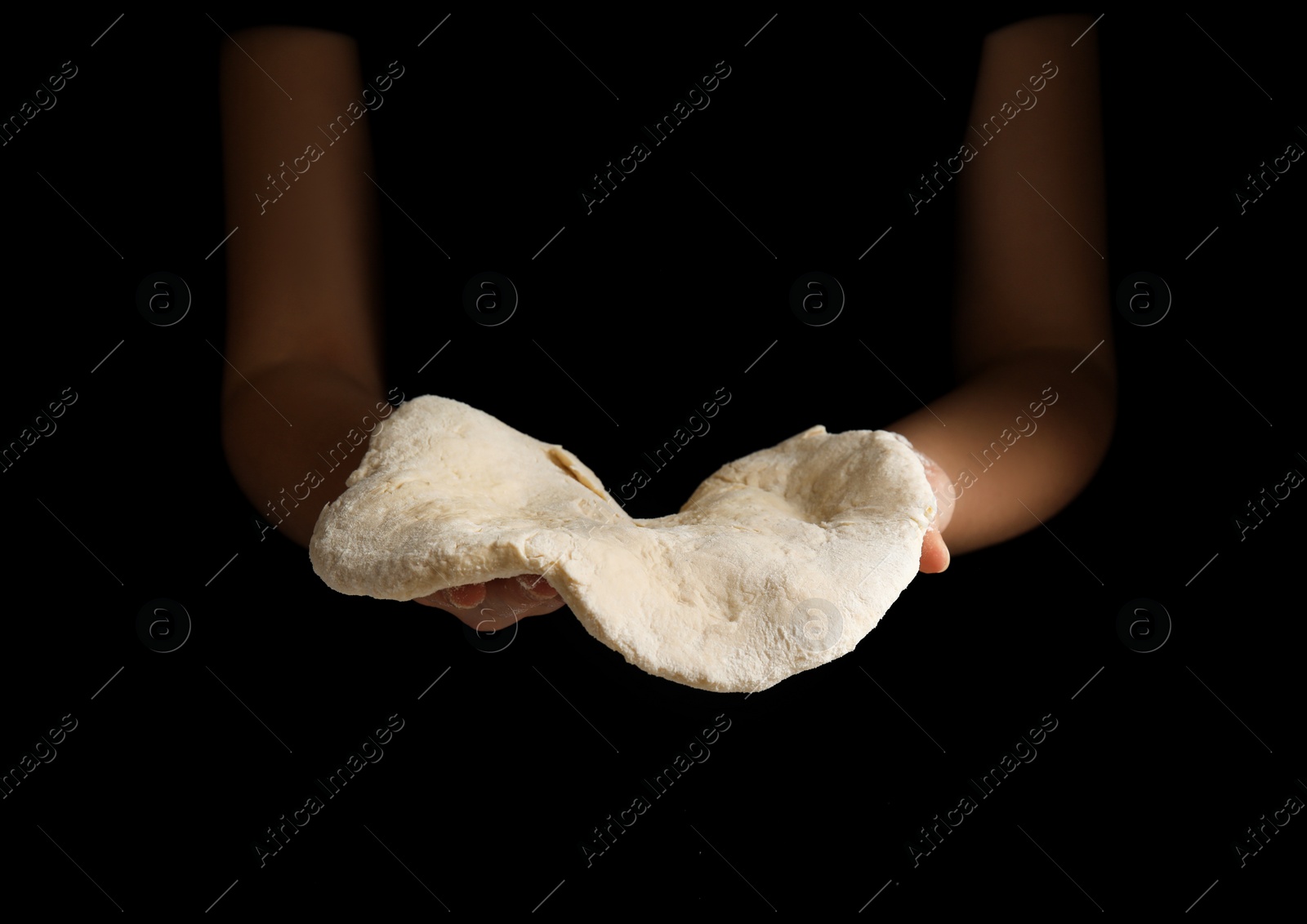 Photo of Woman preparing dough for pizza on black background, closeup