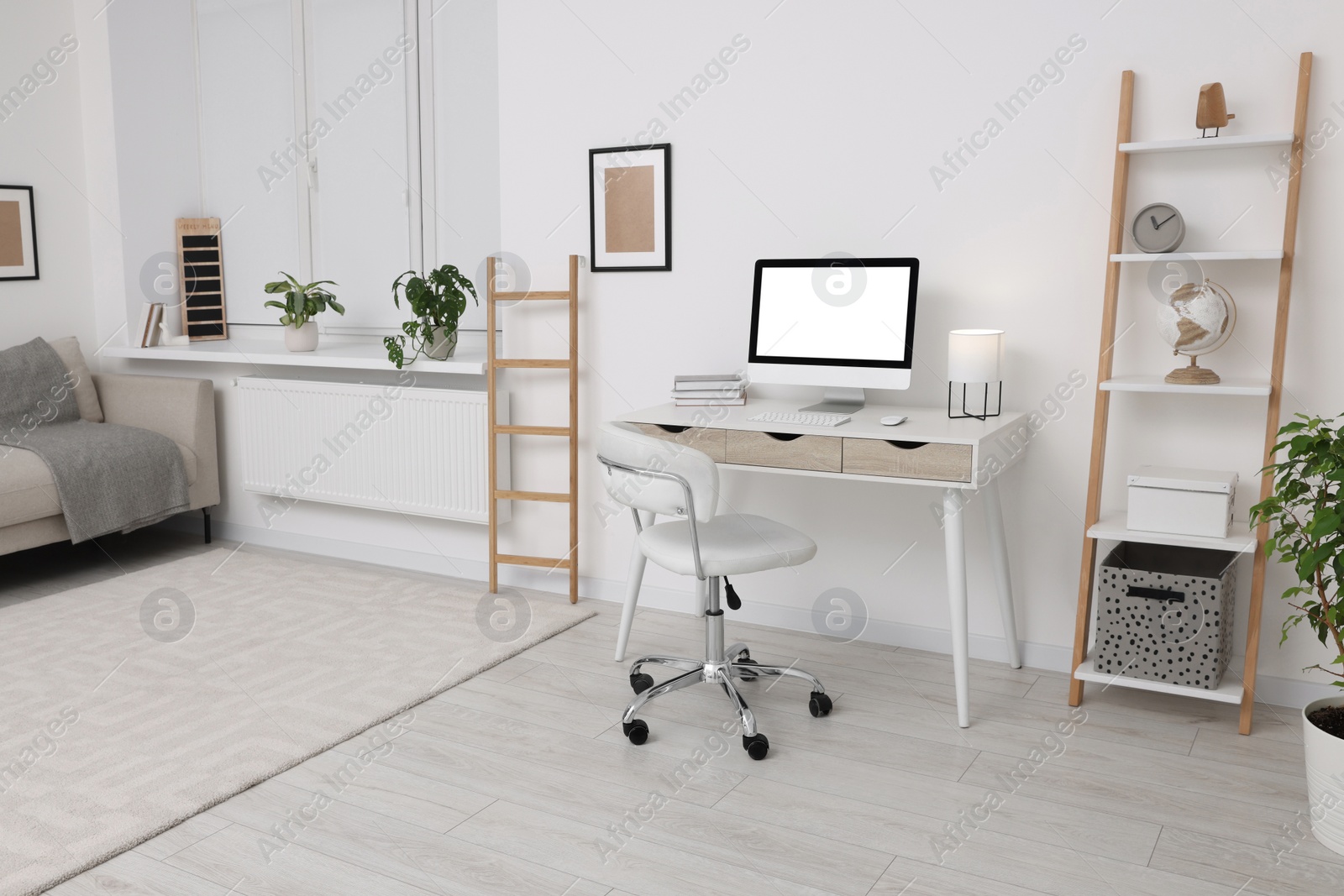 Photo of Workplace with comfortable office chair indoors. Interior design